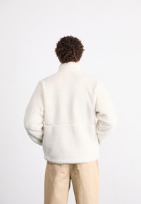 The North Face EXTREME JACKET - Fleecejacka - white dune