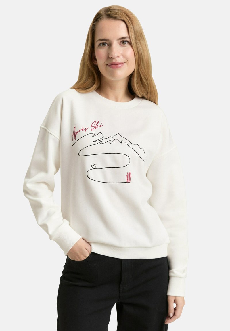 Weißes Sweatshirt mit einem "Apres Ski"-Motiv, das Berge in Schwarz und Rot sowie wellenförmige Linien zeigt. Gerippte Bündchen und Saum.