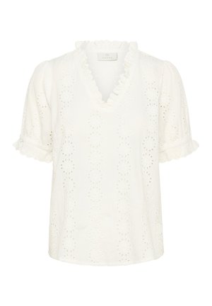 Camicia bianca con scollo a V, maniche corte a sbuffo, bordi arricciati e intricati motivi floreali traforati su tutto il tessuto.