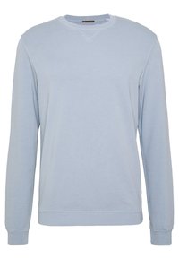 Světle modrý svetr s dlouhými rukávy, žebrovanými manžetami a lemem. Disponuje decentním designem ve tvaru V, hladkou texturou a minimálními švy.