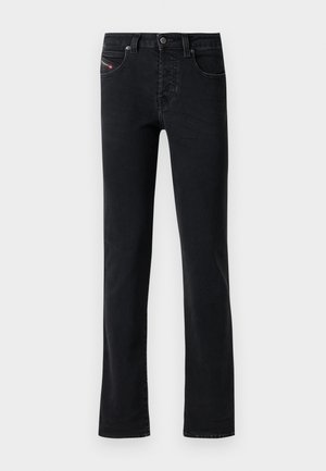 Black denim jeans with a straight cut, featuring five pockets and subtle stitching details. The fabric has a smooth texture and minimal fading.