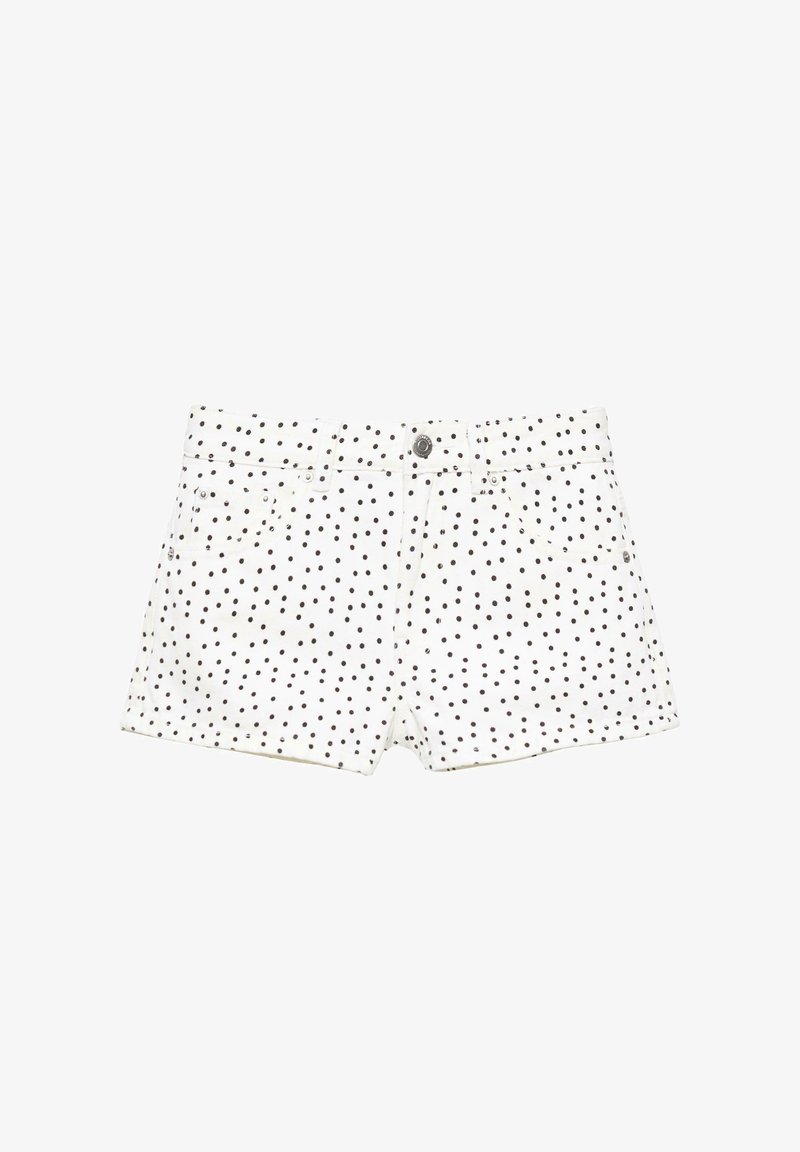 Short en denim blanc à pois noirs, fermeture à boutons et zip sur le devant, avec passants pour ceinture.