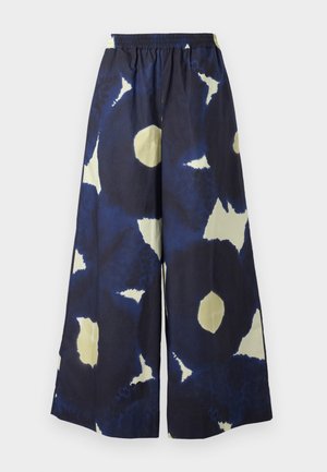 Blue and cream patterned wide-leg pants with an elastic waistband. Material appears lightweight and textured. Features irregular shapes throughout.