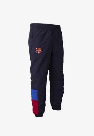 Marineblauwe sportbroek met elastische taille en boorden, voorzien van een meerkleurig logo op de bovenbeen en rode en blauwe kleurblokken nabij de enkel.