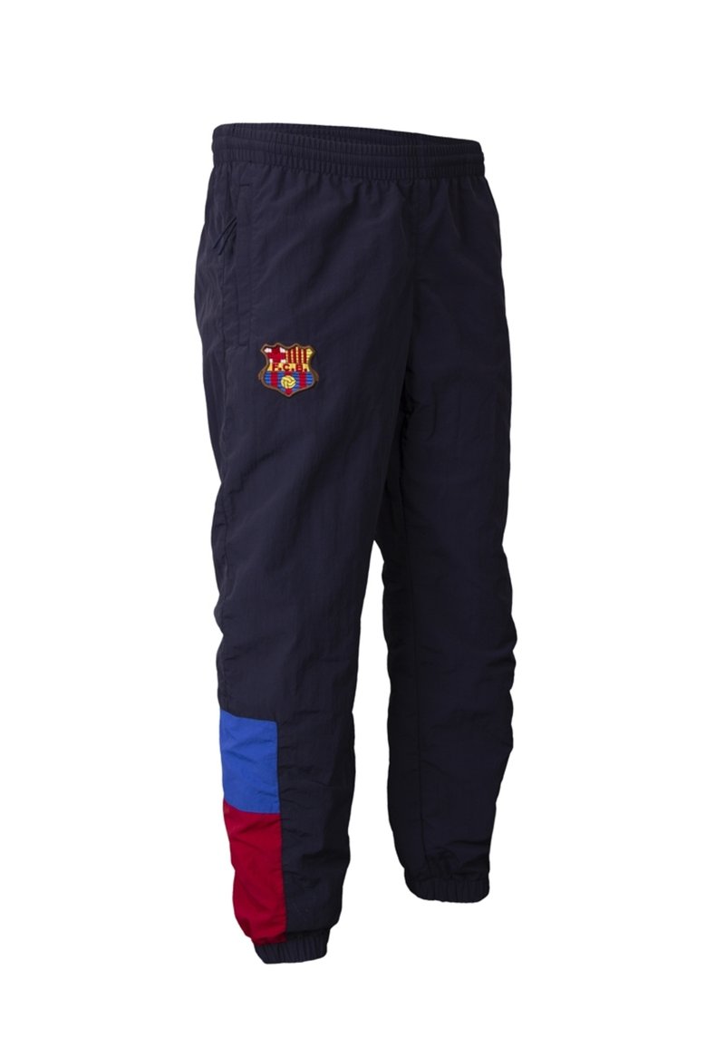 Marineblauwe sportbroek met elastische taille en boorden, voorzien van een meerkleurig logo op de bovenbeen en rode en blauwe kleurblokken nabij de enkel.