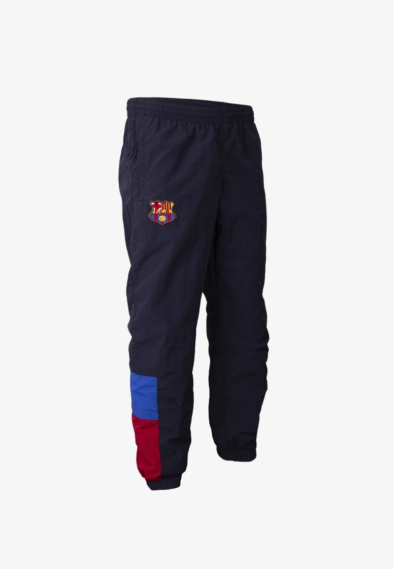 Marineblauwe sportbroek met elastische taille en boorden, voorzien van een meerkleurig logo op de bovenbeen en rode en blauwe kleurblokken nabij de enkel.