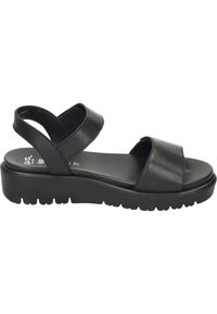 Sandali platform in pelle nera con due ampie cinghie incrociate, una soletta imbottita e una suola in gomma testurizzata per una migliore aderenza.