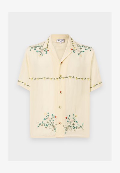Short-sleeve, light yellow shirt made of smooth fabric, featuring colorful embroidered floral patterns, buttons, and a relaxed collar design.