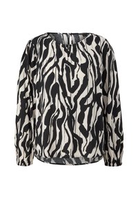 Blouse à motif noir et blanc avec des manches longues, un col rond et des poignets élastiques ; se distingue par un tissu texturé et une subtile ouverture dans le dos.