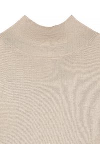 Beige knitted fabric with ribbed high neckline and smooth texture, showing close-up detail of sweater's upper section.