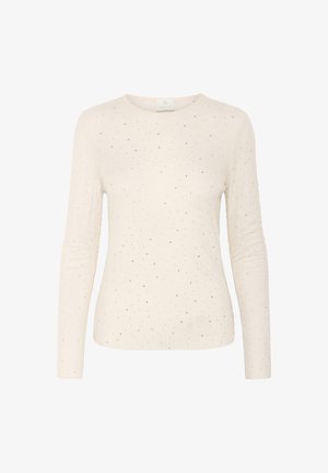 Top à manches longues couleur crème en tissu doux, avec un motif subtil de petites paillettes argentées. Encolure ronde, design ajusté.