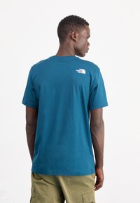 The North Face NEVER STOP EXPLORING TEE - Camiseta estampada - midnight petrol