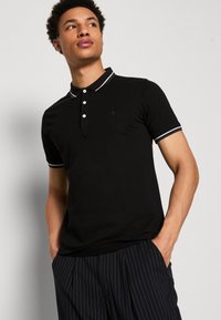 Lindbergh CONTRAST PIPING - Bluză polo - black