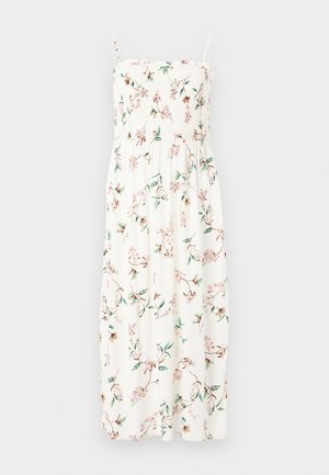 Maxikleid mit spaghetti-Trägern und gerafftem Oberteil; zeichnet sich durch grüne und rosa Blumen auf einem weißen Stoffhintergrund aus. Weiches und leichtes Material.