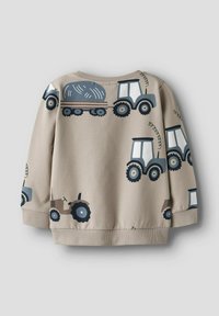 Felpa beige con varie illustrazioni di trattori in blu scuro e blu chiaro. Tessuto morbido con polsini e orlo a costine.