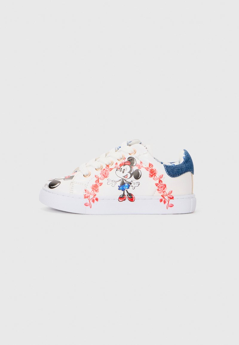 White sneakers featuring a graphic of a cartoon character surrounded by red floral designs. Blue denim accents on the heel and lace-up closure.