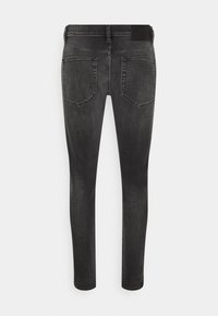 Smala jeans i mörkgrå denim med en mjuk yta, femfickorsdesign och bältesloopar. Har en loggoprydd midja på baksidan.