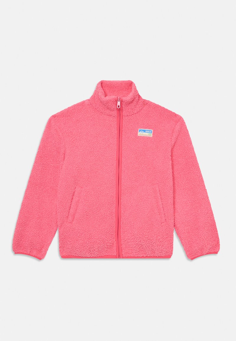 Kerge fliistekk särg heledat roosat värvi, kõrge krae, täispikk zipp ja kaks eesmist taskut. Särgil on tekstuuriga kangas ja silt vasakul küljel.