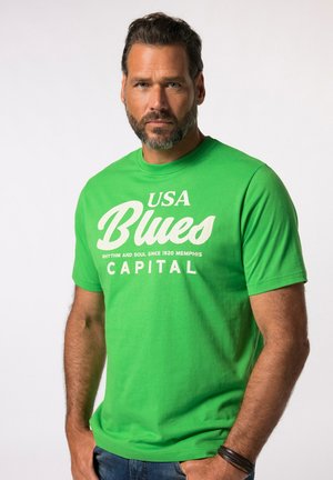 Zielony bawełniany t-shirt z białym nadrukiem: "USA Blues Capital" oraz "Rhythm and Soul Since 1920 Memphis" z przodu. Krótkie rękawy.