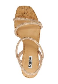 Tan cork heel sandal with a square toe, featuring three crossed straps adorned with clear rhinestones. "Dune London" label present.