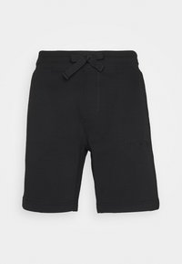 Schwarze Shorts aus weichem Material mit elastischem Bund und vorne gebundenem Detail. Verfügt über Seitennähte und ein dezentes Logo am Bein.