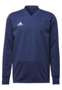 Marinblå långärmad träningströja i texturerad tyg med V-ringning, med tre vita ränder och en Adidas-logga på bröstet.