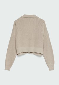 Beige kort stickad tröja med en stickad textur, långa ärmar och krage. Har ribbstickade avslut vid ärmsluten och nederkanten.