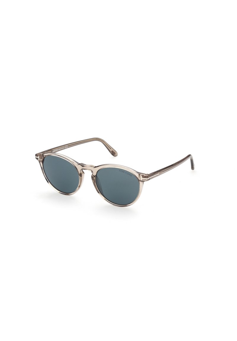 Runde Sonnenbrillen mit einem transparenten, hellbraunen Kunststoffrahmen und dunklen, getönten Gläsern. Elegante Metallakzente an den Bügeln.