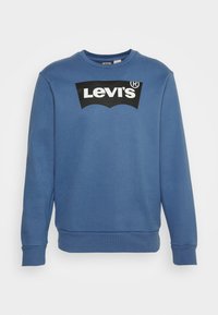 Sweat-shirt bleu à col rond avec manches longues et logo Levi’s noir centré sur la poitrine.