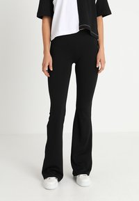 ONLY - ONLPAIGE FLARED PANT - Trousers - black Thumbnail Image 1