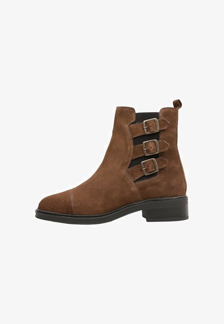 Brown suede ankle boot with a pointed toe, three decorative buckles on the side, elastic panels, and a low block heel.
