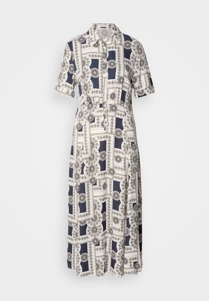 Une robe à manches courtes, longueur genou, avec un motif géométrique en bleu marine et crème, dotée de boutons et d'un col. Tissu léger.