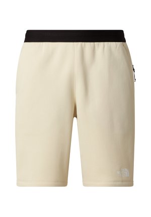 Béžové šortky s černým elastickým pasem, střih sahající ke kolenům, hladká textura a malým bílým logem na levé noze.