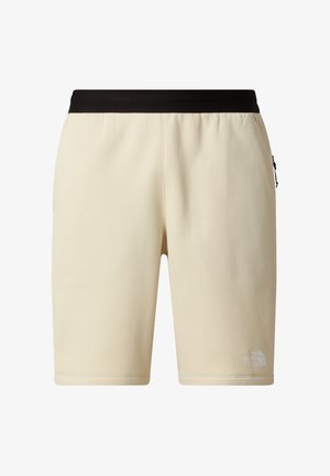 Béžové šortky s černým elastickým pasem, střih sahající ke kolenům, hladká textura a malým bílým logem na levé noze.