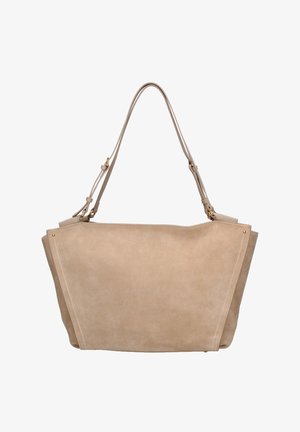Beige suede tote bag with adjustable shoulder strap, trapezoid shape, visible stitching, and small gold-tone metal accents.