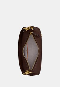 Brown leather handbag with gold hardware, open zipper revealing light fabric interior and small inner pocket with button closure.