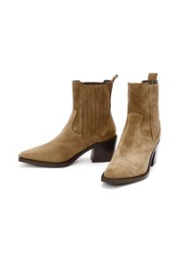 Brown suede ankle boots with a pointed toe, textured side panels, and a stacked heel. Features a pull tab for easy wear.