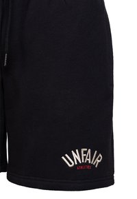 UNFAIR ATHLETICS Spodnie treningowe
