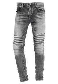 Šedé skinny džíny z denimu s vybledlým vzhledem, vybavené kolenními panely, horizontálními žebrovanými detaily a tradičním pětivreckovým designem.