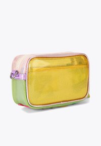 Transparent cosmetic pouch with pink, yellow, and green sections. Features shiny texture, zipper closure, and a small loop for hanging.