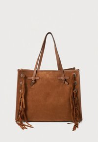 Braune Wildleder-Shopper-Tasche mit zwei langen Trägern, seitlichen Quasten und Metallelementen. Rechteckige Form mit einem klaren, minimalistischen Design.