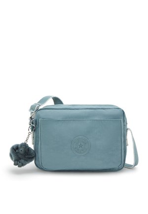 Light blue crossbody bag made of textured nylon. Features a zip closure, adjustable strap, and a detachable fluffy keychain charm.