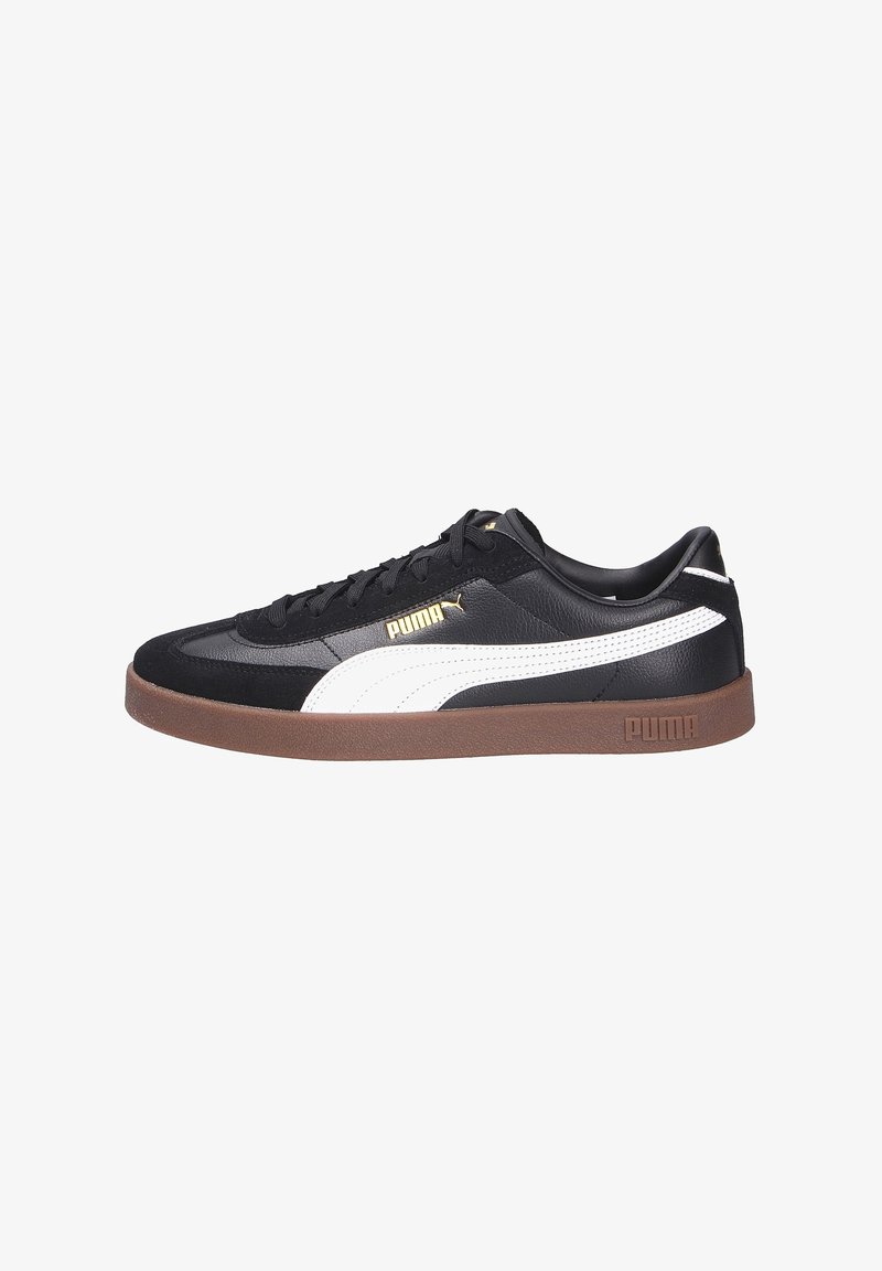 Baskets Puma noires avec bande blanche latérale, semelle brune, logo Puma doré sur le côté et la languette, design bas et fermeture à lacets.