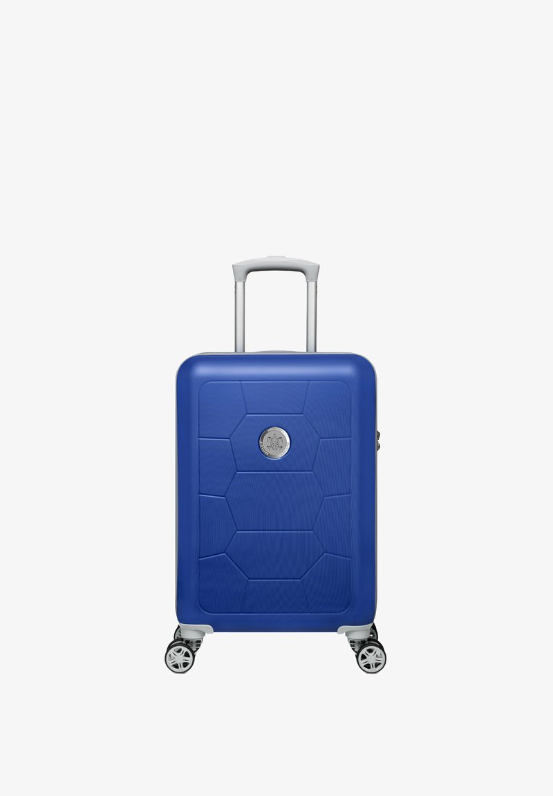 Blauwe harde koffer met een gestructureerd hexagonaal patroon, zilveren handvat en vier draaiwielen. Heeft een rond logo aan de voorkant.