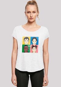 White short-sleeve t-shirt featuring a colorful graphic design with four illustrated faces, each bordered by bright colors: yellow, green, blue, and pink.