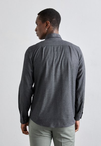 Gray long-sleeve shirt with a smooth texture, button cuffs, and a classic collar design. Features a subtly tailored back for fit.