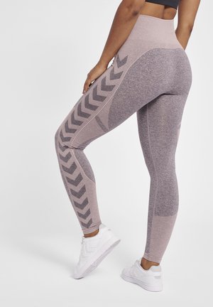 Leggings a vita alta in mauve chiaro con pannelli testurizzati e motivi a chevron in mauve scuro. Realizzati in tessuto elastico, adatti per l'esercizio.