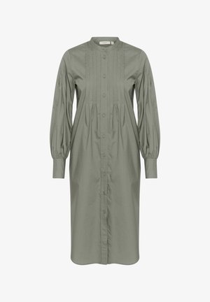 Zöld pamutruha hosszú puffos ujjal, gombos előlappal, függőleges redőzéssel és formázott gallérral. A dizájn térd alatt érkezik, laza szabással.