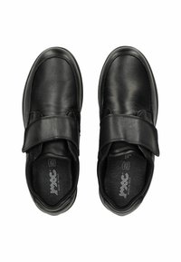 Black leather shoes with a rounded shape, featuring a wide Velcro strap across the top for easy adjustment and a cushioned insole.
