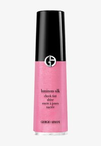 Rosa kindpuder i en cylindrisk behållare med ett glänsande svart lock. Har logotypen och produktnamnet tryckt på framsidan i svart.